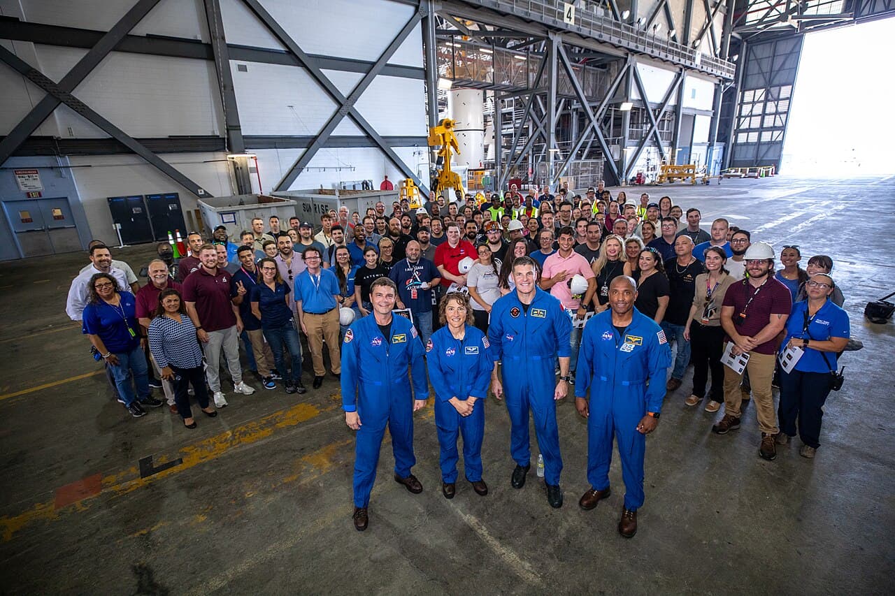 Artemis II astronauts visit NASA’s Kennedy Space Center in Florida on Aug. 7, 2023. In front, from left, are NASA astronauts Reid Wiseman and Christina Koch, CSA (Canadian Space Agency) astronaut Jeremy Hansen, and NASA astronaut Victor Glover in the transfer aisle of the Vehicle Assembly Building. Behind them are Exploration Ground Systems team members. The approximately 10-day Artemis II flight will test NASA’s foundational human deep space exploration capabilities, the Space Launch System rocket and Orion spacecraft, for the first time with astronauts and will pave the way for lunar surface missions, including landing the first woman and the first person of color on the Moon.