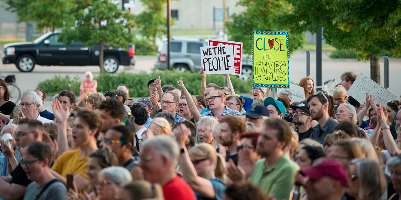 St. Paul, Minnesota July 12, 2019 About 500 people gathered outside an ICE location at the Fort Snelling Whipple Federal Building to protest the detention policies of Republican President Donald Trump. Immigrants seeking asylum or caught crossing the southern border of the USA have been detained, with children detained separately from their families. Separation of children and detention camps for children have grown to record levels during the Trump years. There have been reports of inhumane conditions at the detention centers, and children as young as seven have had to appear before immigration judges without their parents or legal representation. 2019-07-12 This is licensed under the Creative Commons Attribution License. Give attribution to: Fibonacci Blue